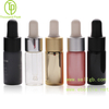 Custom colored 10ml tubular glass dropper bottles (Matte Black, Gold, Pink) showing OEM spraying and printing services. Factory direct customization. SKU: SK21-G10-2252.