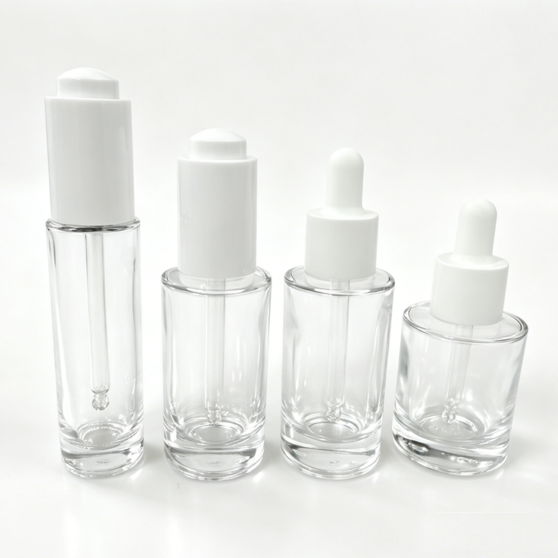 30ml clear glass serum bottles with white dropper caps in four different heights and designs for cosmetic packaging.